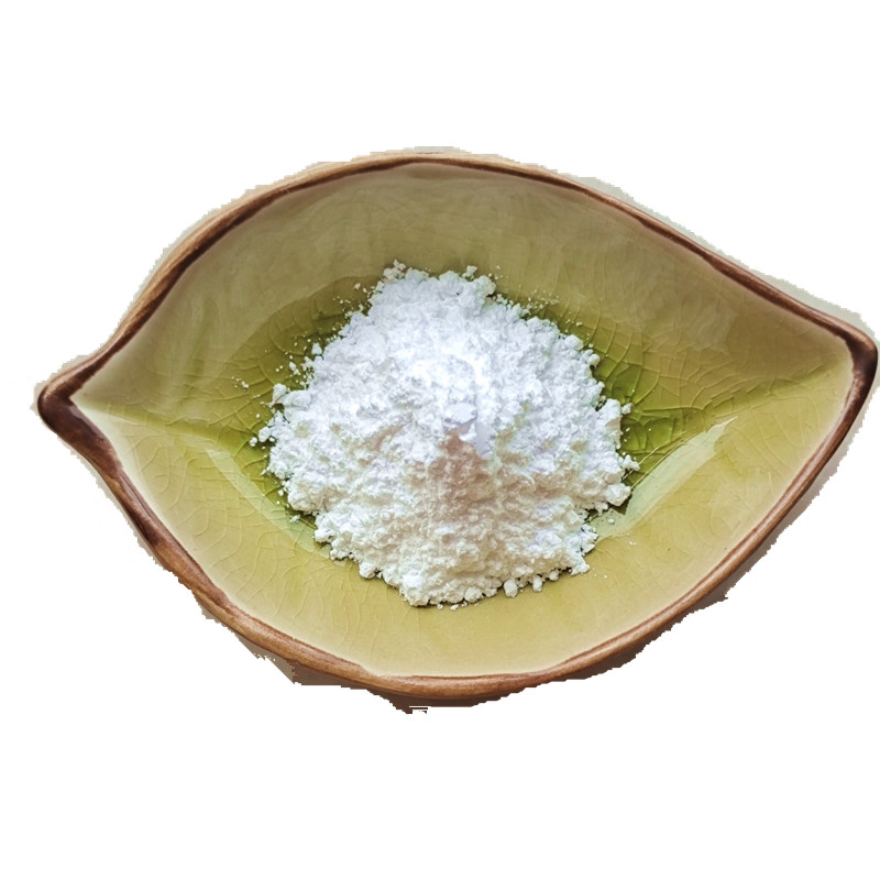 Pure synbiotic matrix powder in a small green ceramic leaf bowl, illustrating natural probiotic and prebiotic synergy for digestive support.